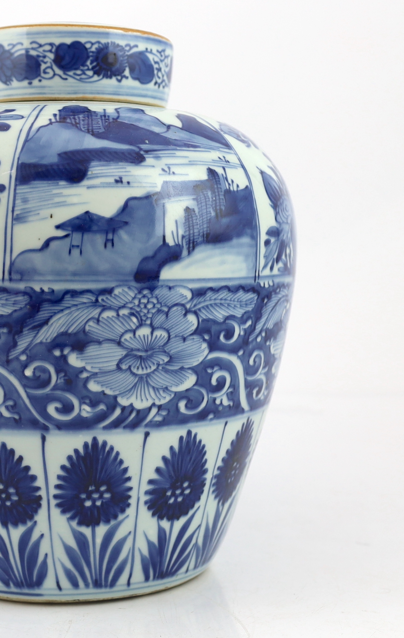 A Chinese blue and white ovoid jar and cover, Kangxi period, broken with kintsugi repair